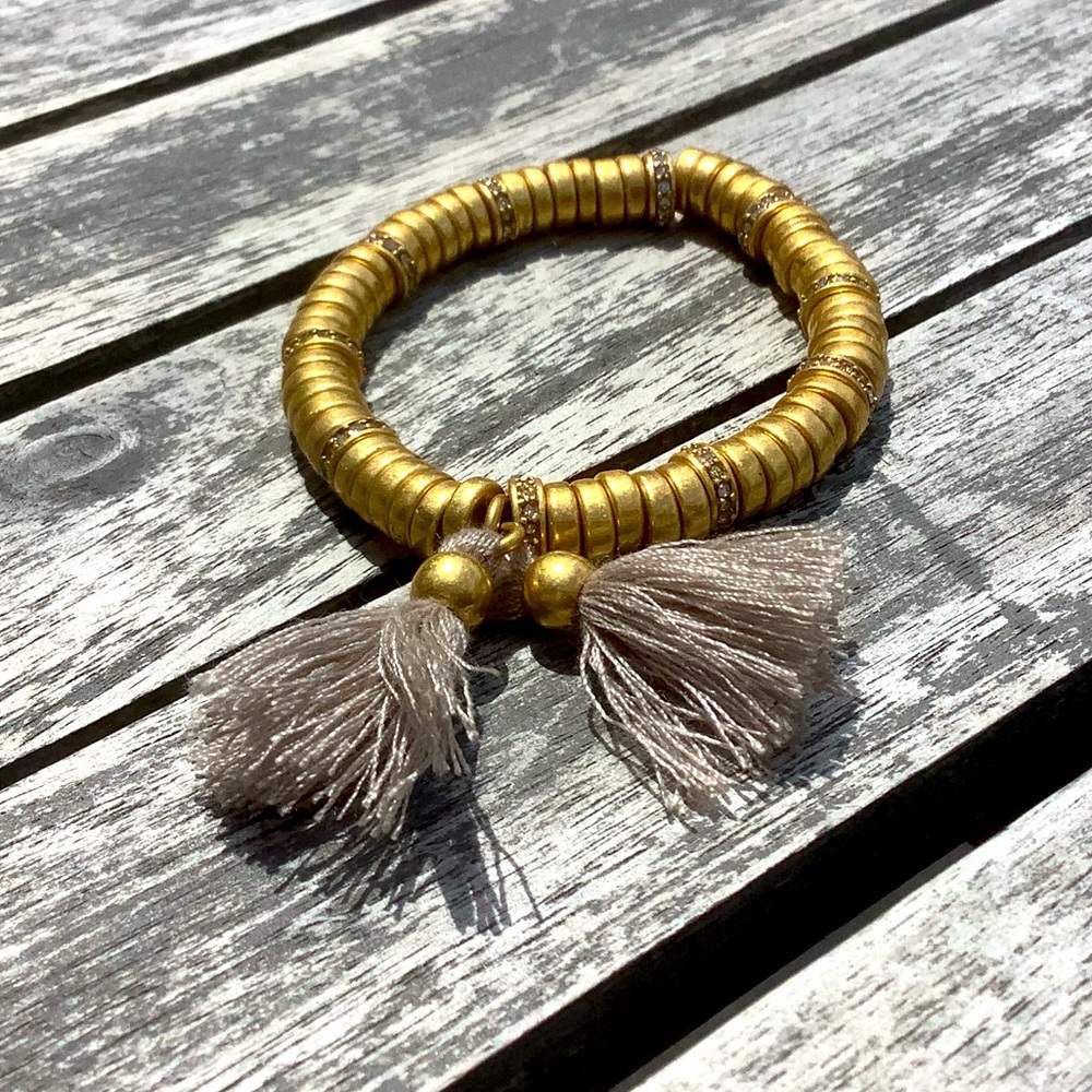 Gold color bracelet with tassels